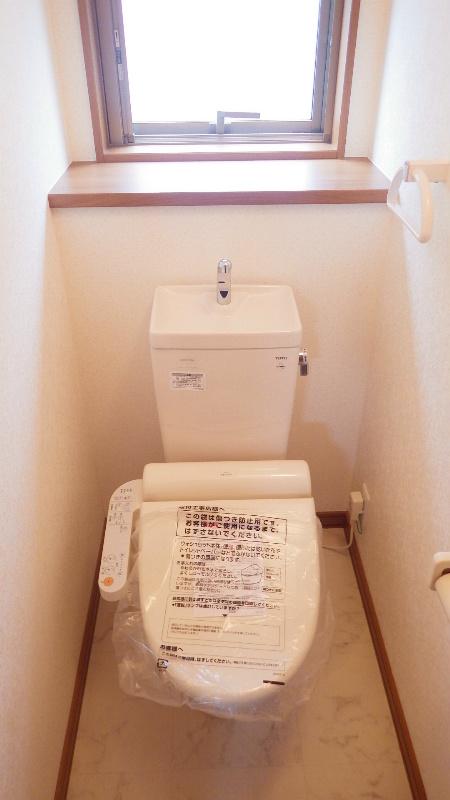 Toilet. Bright toilet there is a window