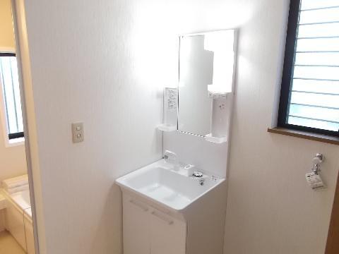 Wash basin, toilet. Wash basin already replaced with a shower, Cemented floor cushion floor, Already in place Paste Cross.