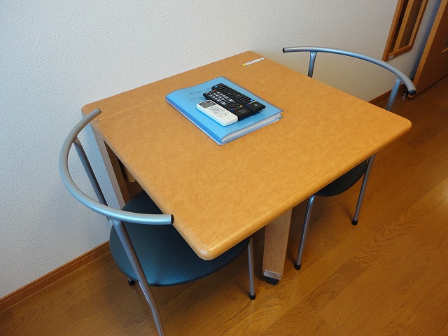 Other Equipment. There are two-legged tables and chairs.