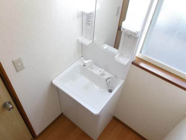 Wash basin, toilet. Wash basin is with a new article of the shower. 