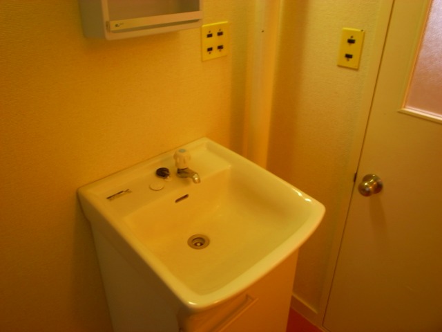 Washroom. It is simple and wash basin with cleanliness!