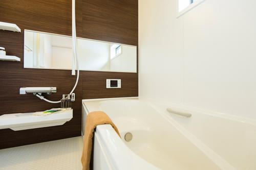 Bathroom. A clean bathroom with a window for ventilation. To accent the brown, And finished with a bright atmosphere.