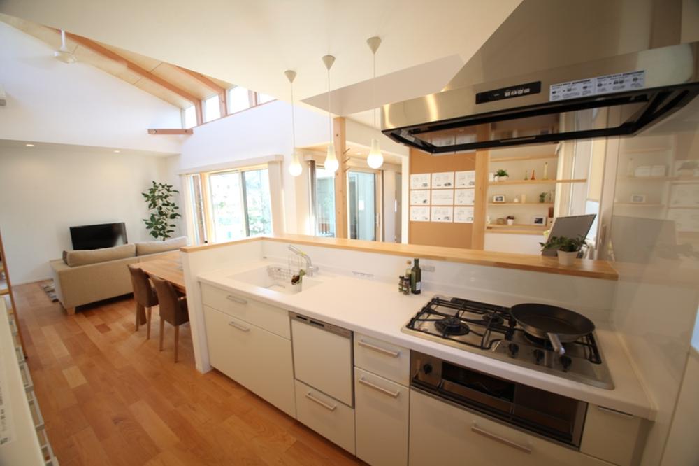 Model house photo. Forest kitchen of the rainbow ・ Open style kitchen is born gatherings with family. Relationship with the utility space is also a point of interest.