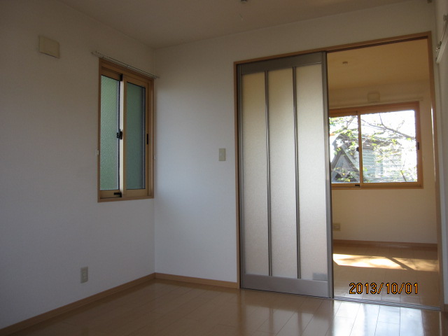 Living and room. Partition door through which light