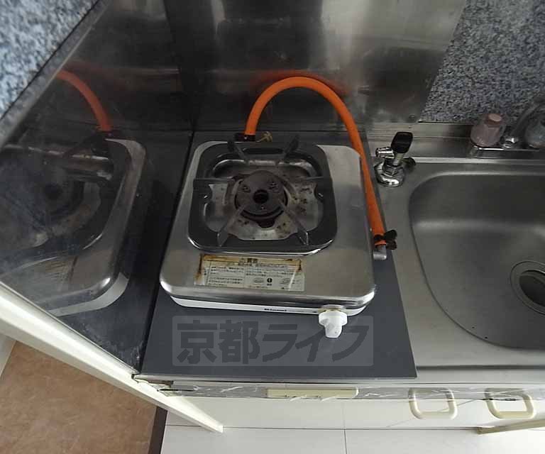 Kitchen. It is a stove with a equipped.