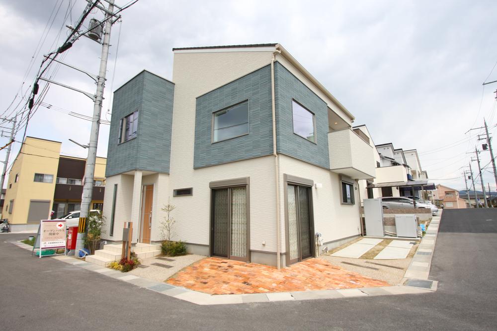 Local appearance photo. Model house two-tone color is stylish impression. Parking space is also firmly secured!