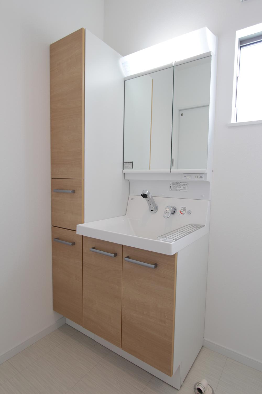 Wash basin, toilet. There is in the wash basin is a lot of storage, It it the best of the housing stock, such as towels and detergent.
