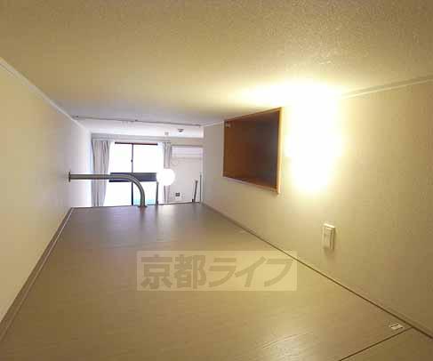 Living and room. It is between hobby is with a loft.