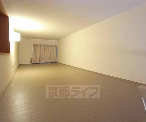 Living and room. It is between hobby is with a loft.