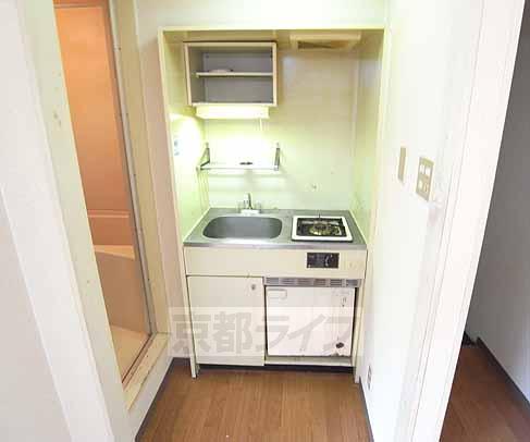 Kitchen. It is with a gas stove.