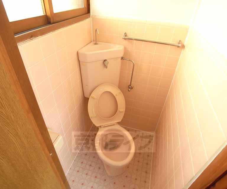 Toilet. There is also a window.