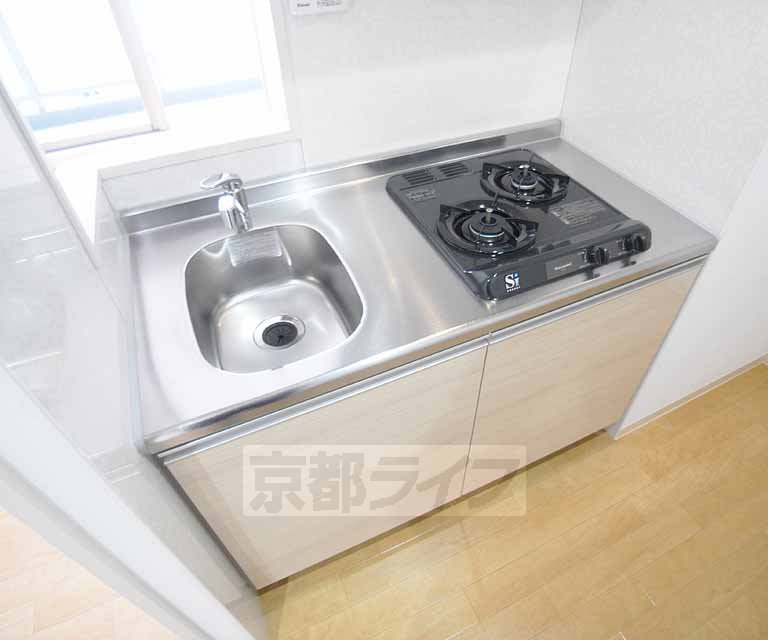 Kitchen. Two-burner gas stove is equipped with.