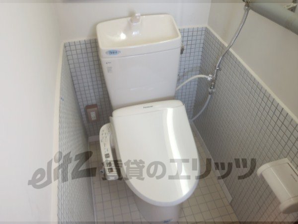 Toilet. It is with washing machine.