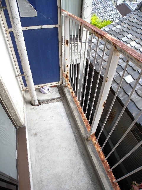 Balcony. Washing machine is the veranda