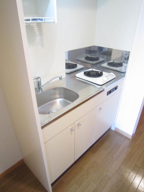 Kitchen. It is with a gas stove.