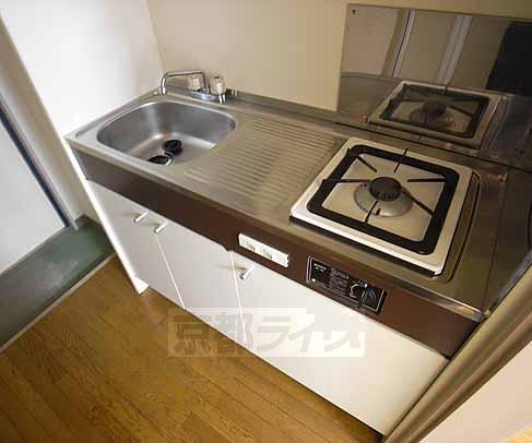 Kitchen. Although kitchen for living alone, Stove next to the cooking space is ...