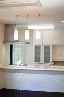 Kitchen. Reference is a picture. Clean in the open kitchen! Counter bottom is accented with tile. 