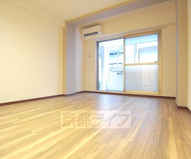 Living and room. It is calm color of flooring.