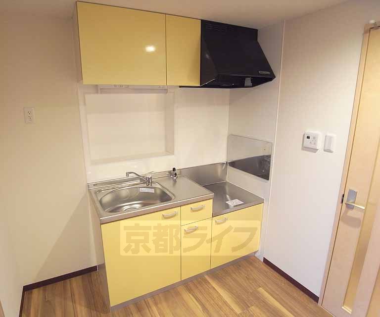 Kitchen. It is a cute yellow color.