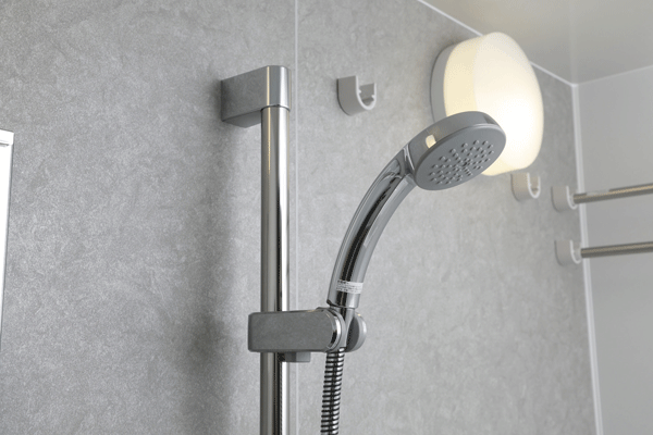 Bathing-wash room.  [Shower head and slide bar] Adopted metallic design is a beautiful shower head. Slide bar of shower height adjustment can be carried out freely is provided (same specifications)