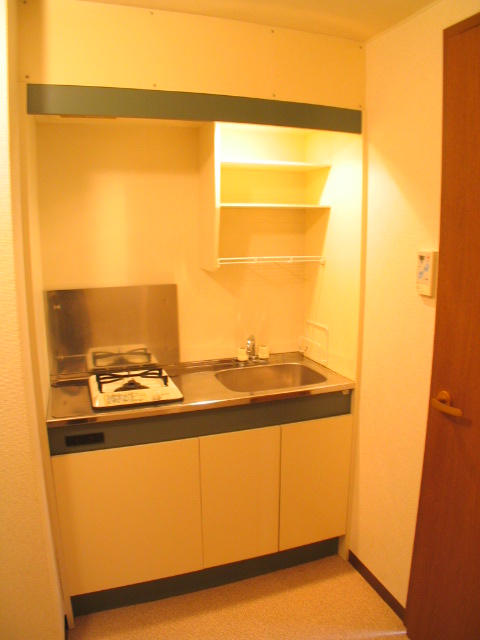 Kitchen. It is with a gas stove.