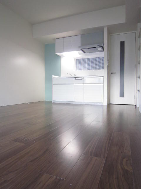 Living and room. Blue walls shine in chic flooring.