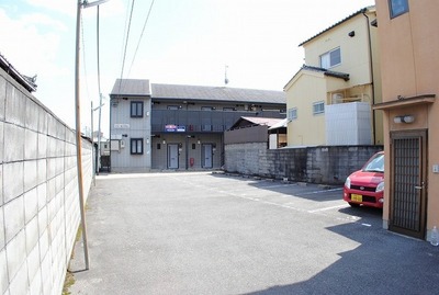 Entrance. Front of the building is a garage.