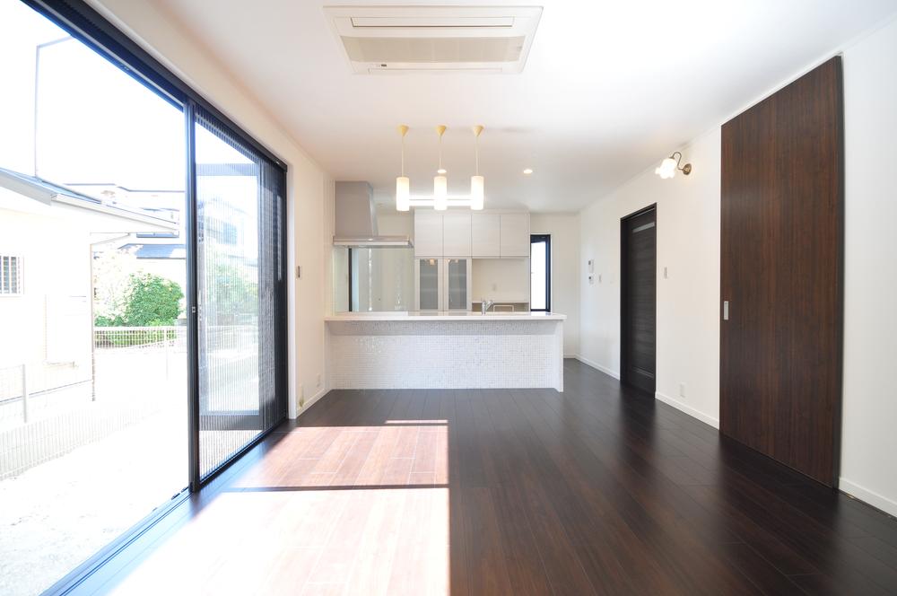 Kitchen. Spacious living room with windows open win