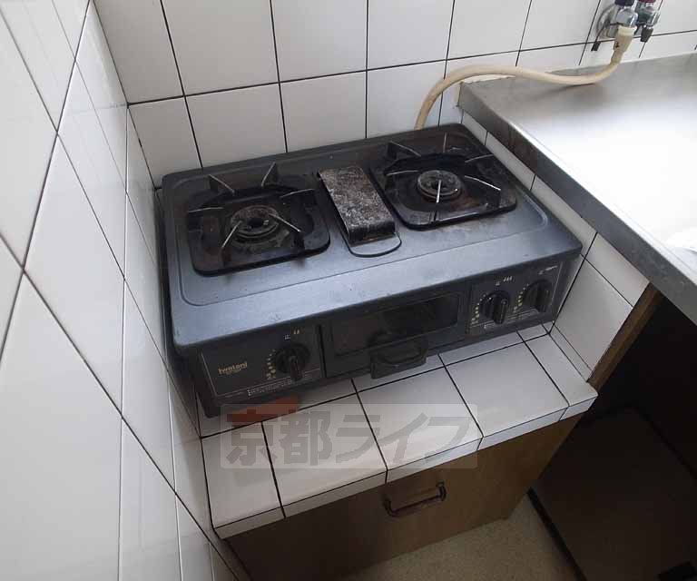 Kitchen. Stove is located in a two-necked.