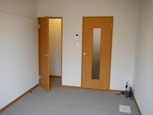 Living and room. The left side is the kitchen, Right before the door is the bath, The back of the door is the toilet