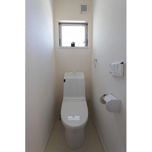 Model house photo. Unified toilet with a white wall
