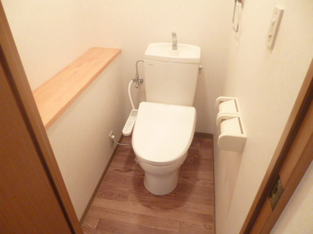 Toilet. Happy Heating ・ Marked with warm water washing toilet seat