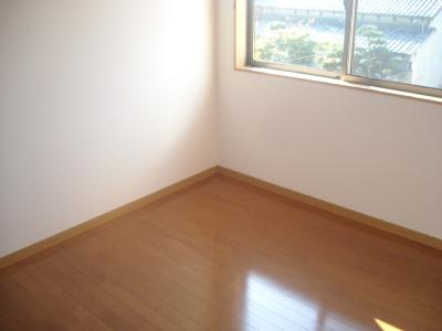 Other room space. There is a window is bright rooms