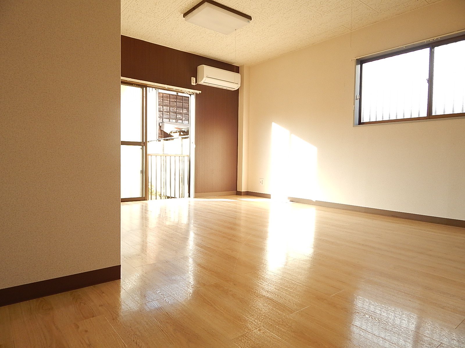 Living and room. It is a bright room with two-sided window in the corner room