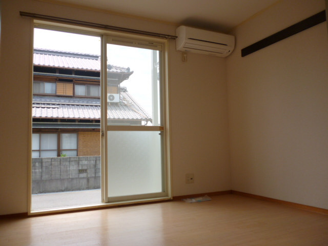 Other room space. A bright room with large windows