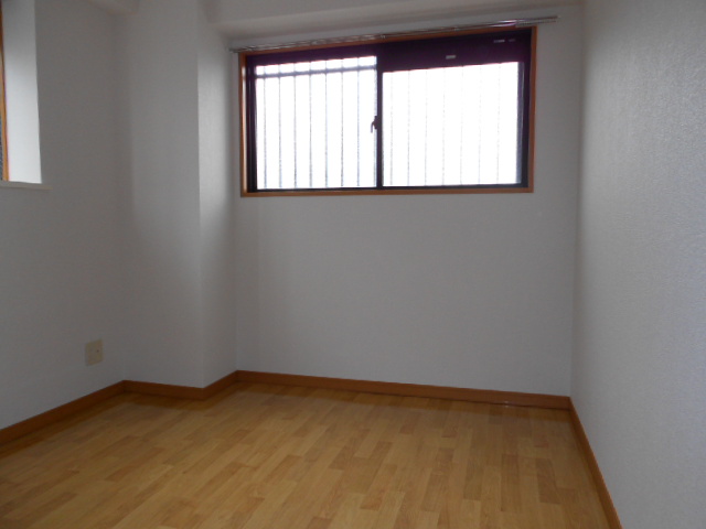 Other room space. There is a bay window on the left