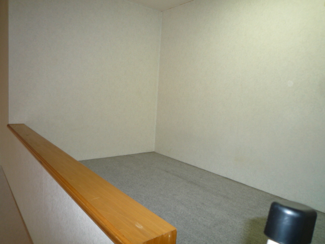 Other room space. The photograph is a corner room.