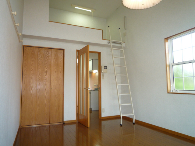 Living and room. The photograph is a corner room.