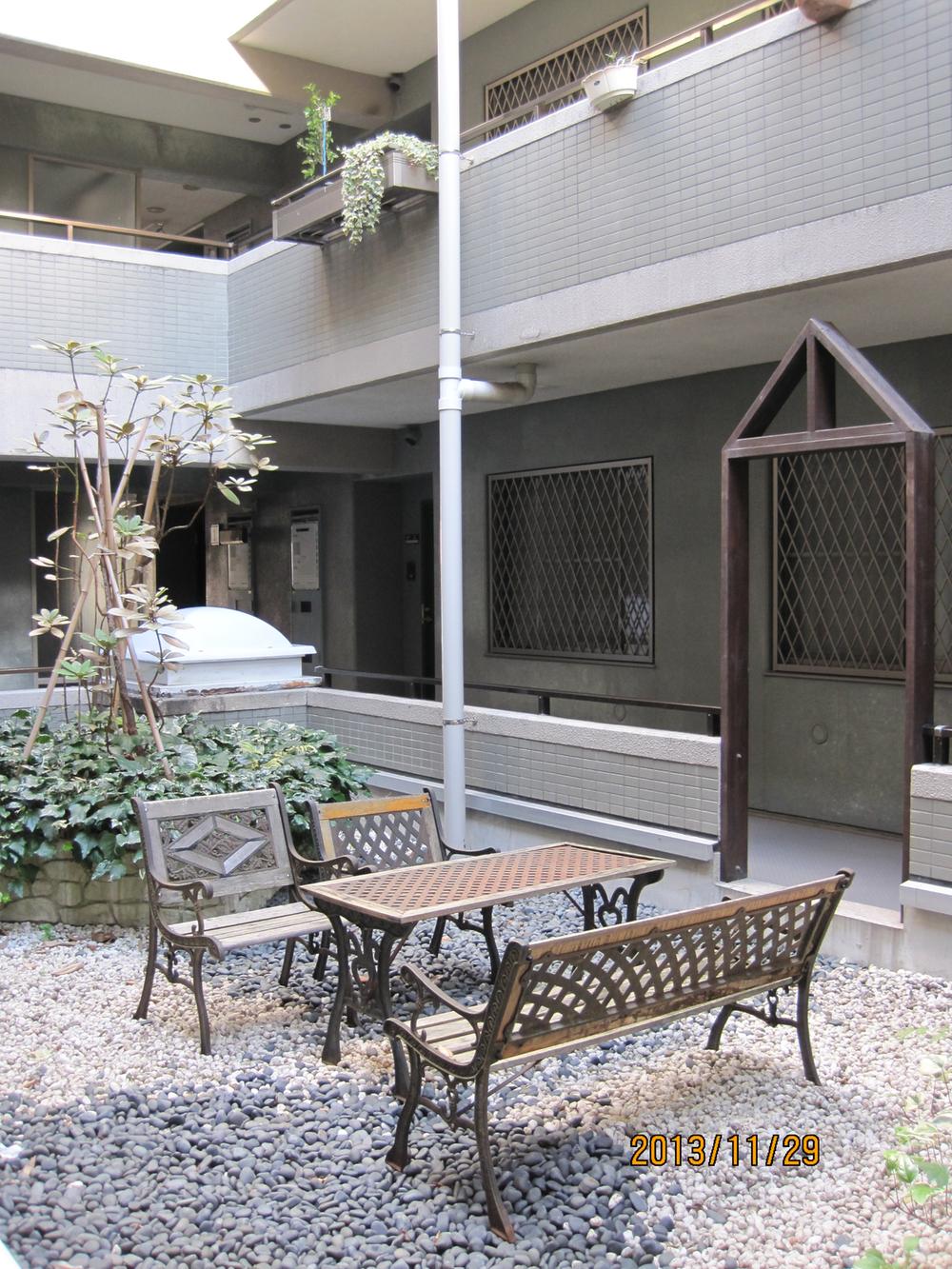 Other common areas. Wood tables and chairs in the courtyard