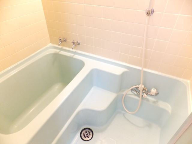 Bath. It is a beautiful light blue bathtub.