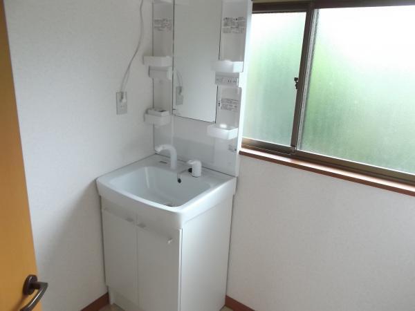 Wash basin, toilet. Washbasin been replaced made INAX