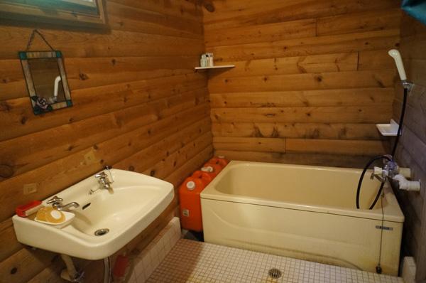 Bathroom. Tub surrounded by trees.