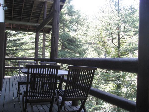 Balcony. I feel a refreshing breeze in the wood deck. Meals and tea time also looks good.