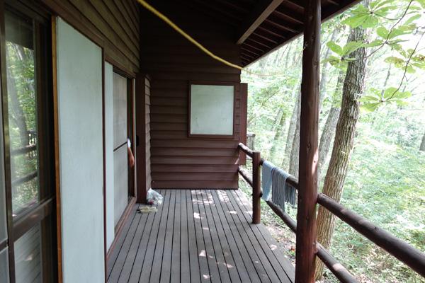 Balcony. Wood deck is less pain because with a roof.