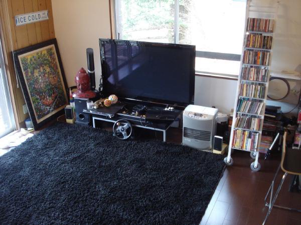 Non-living room. The opening is large and airy is a good living room!