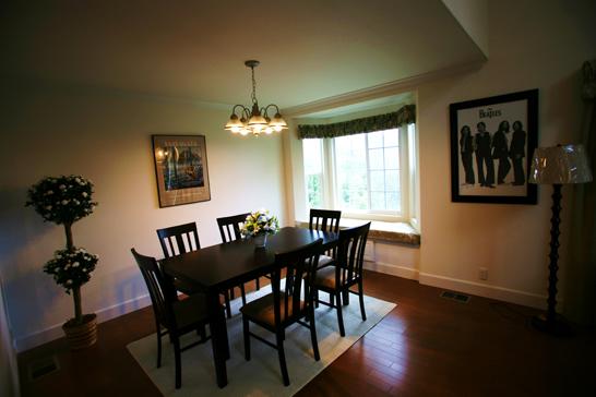 Non-living room. Dining Room: table set, Such as the curtain has been installed.