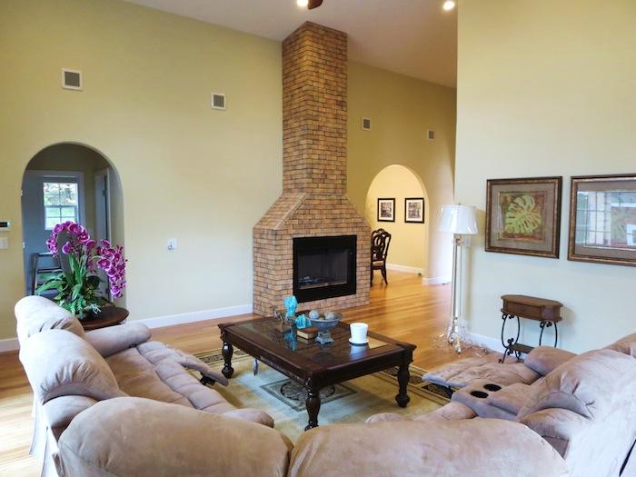 Living. A wood-burning fireplace, Sofa and all, such as a table set coordination already luxury type American House.