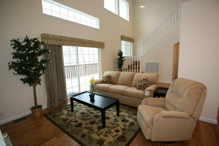 Living. Breadth of the first floor living room is about 16 quires of room. sofa, Table set, A wood-burning fireplace standard equipment. 