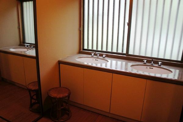 Wash basin, toilet. It is the state of the basin room next to the bath.