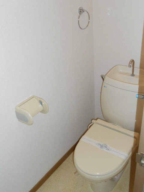Toilet. Heating toilet seat equipped
